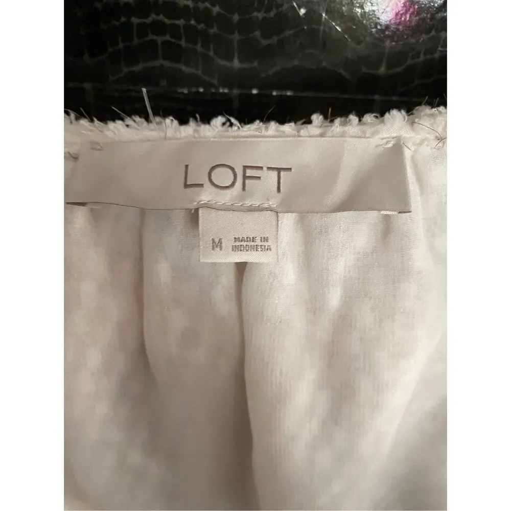 Loft white and gold shimmer ruffle Swiss.blouse size medium.￼